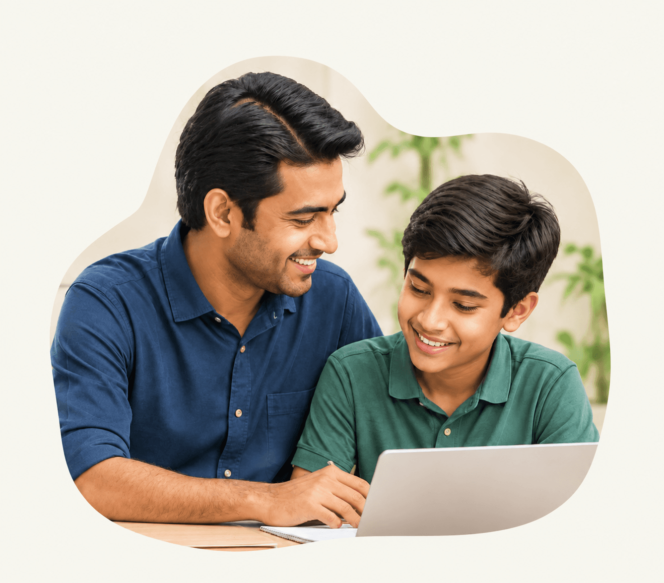 A father helping his son study at home on a laptop